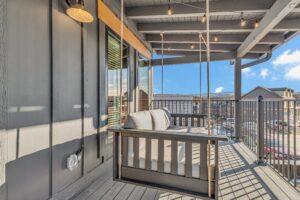 Covered Deck with Hanging Swing & String Lights