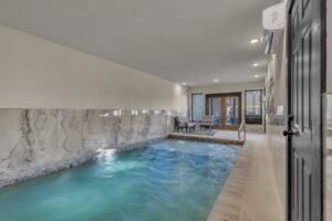Heated Indoor Pool with Lounge Chairs & Patio Access